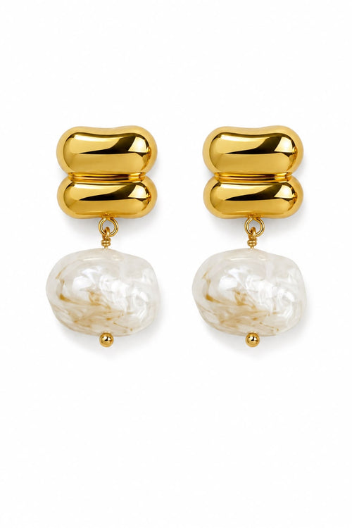 Gold earrings with large pearl-like beads on a white background