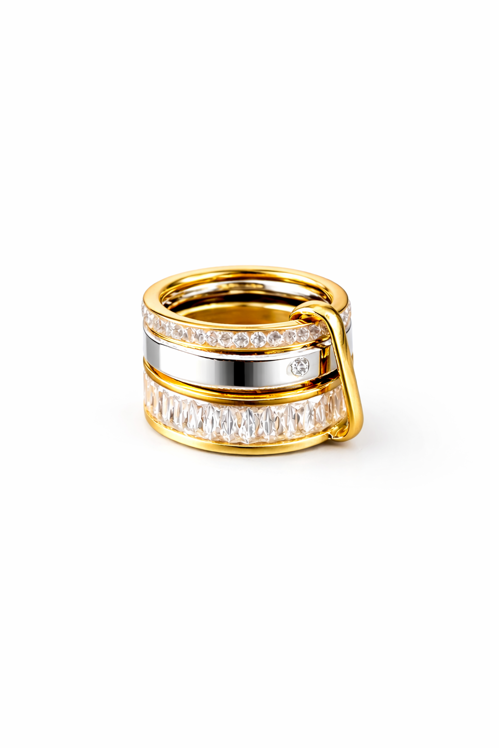 Gold and silver ring with clear zircones on a white background