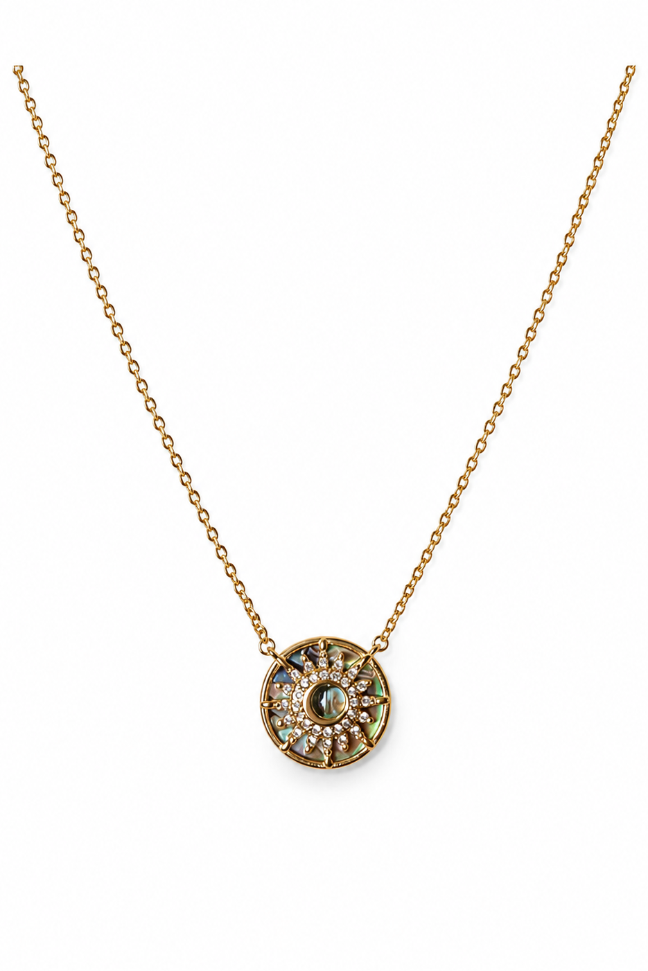 Gold necklace with a circular pendant on a white background