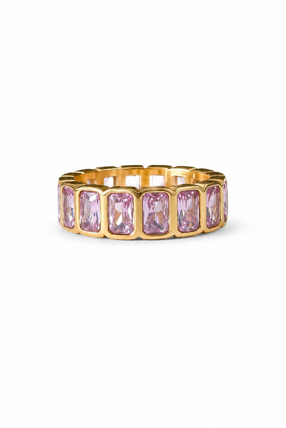 Gold ring with pink gemstones on a white background