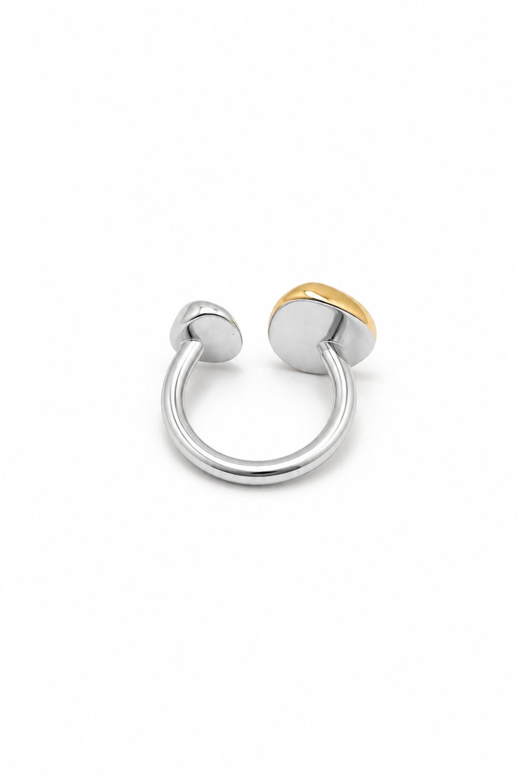 Silver and gold ring on a white background