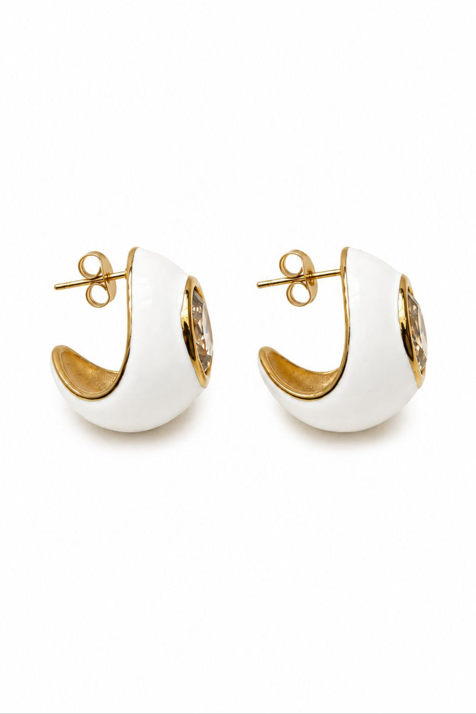 Pair of white hoop earrings with gold accents on a white background
