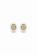 Pair of earrings with gold and white design on a white background