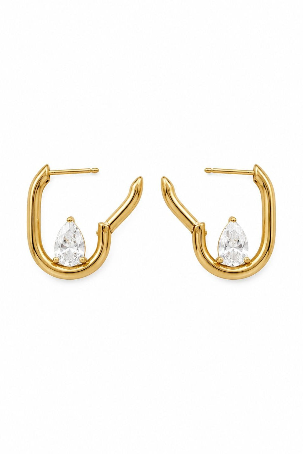 Gold hoop earrings with clear gemstones on a white background