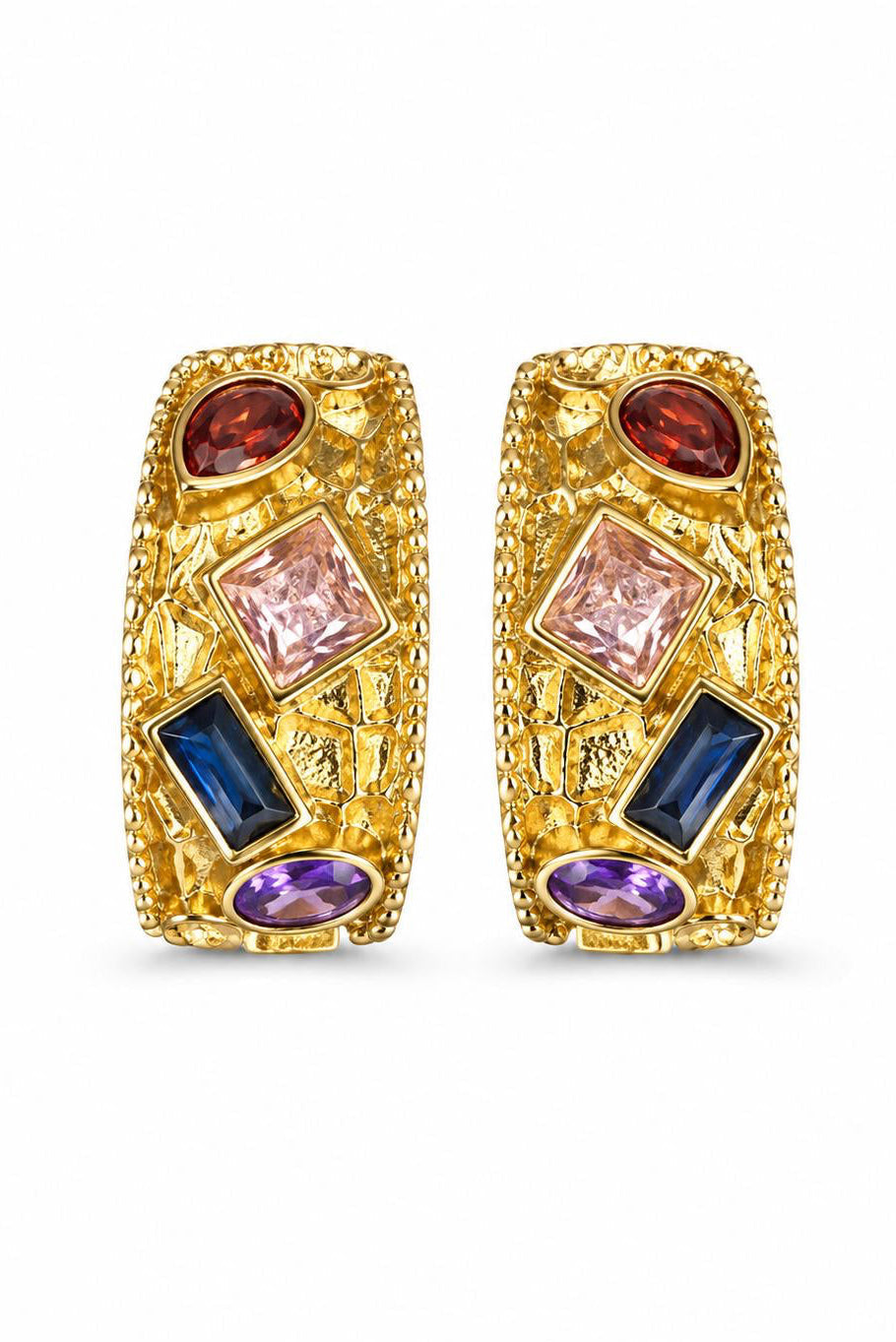 Gold earrings with colorful gemstones on a white background
