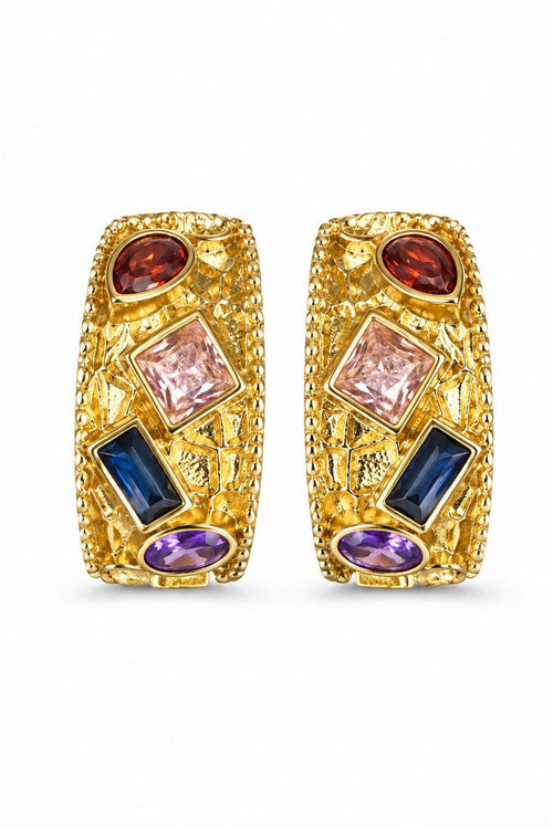 Gold earrings with colorful gemstones on a white background