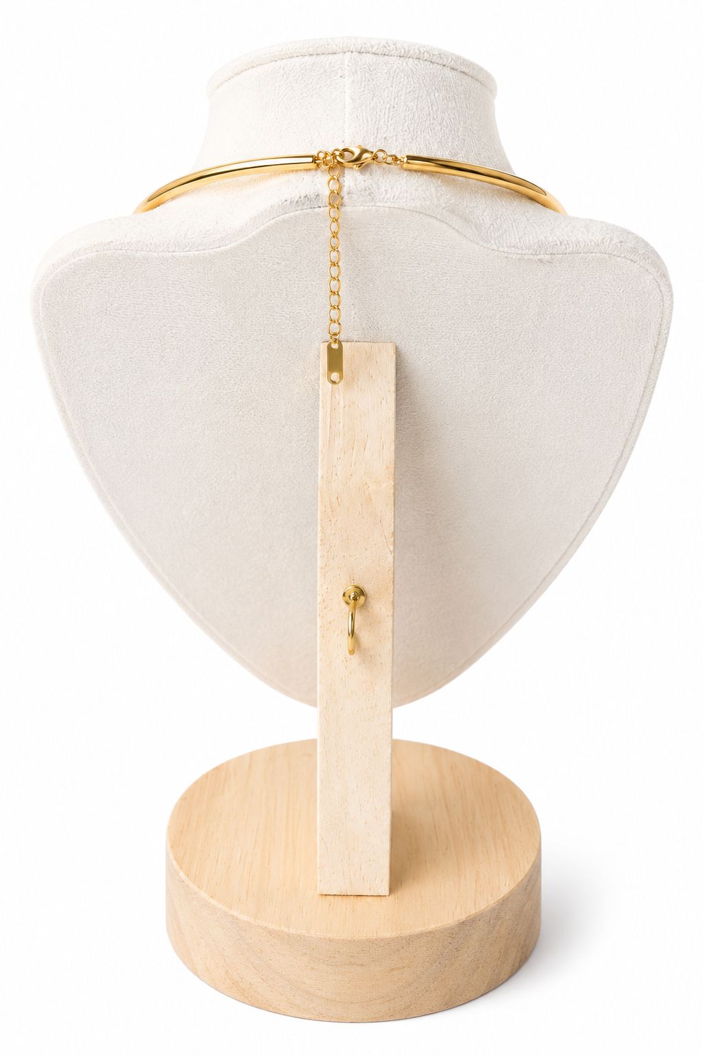 Necklace on a white mannequin bust with a wooden base