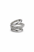 Silver cuff with gemstones on a white background
