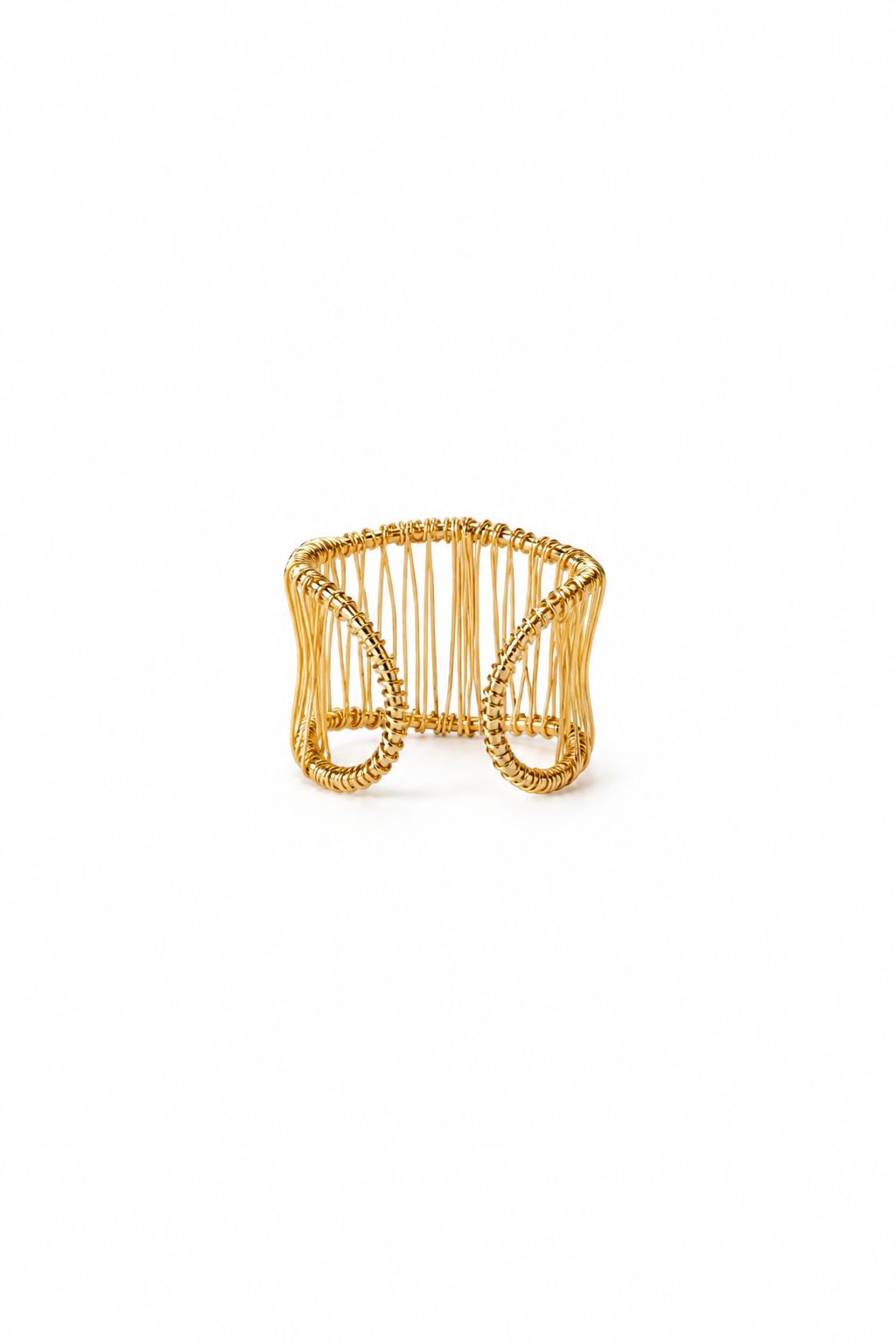 Gold wire ring on a white background