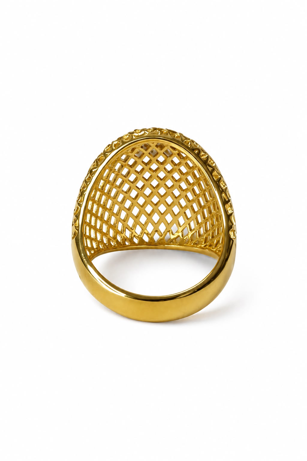 Gold ring with a textured design on a white background