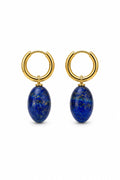 Gold hoop earrings with blue stones on a white background