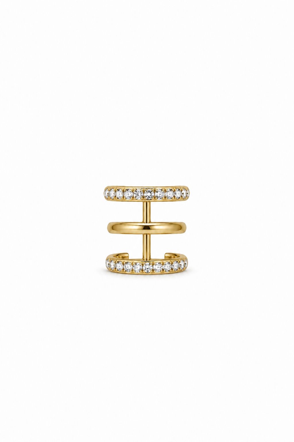 Gold ear cuff with small zirkns on a white background