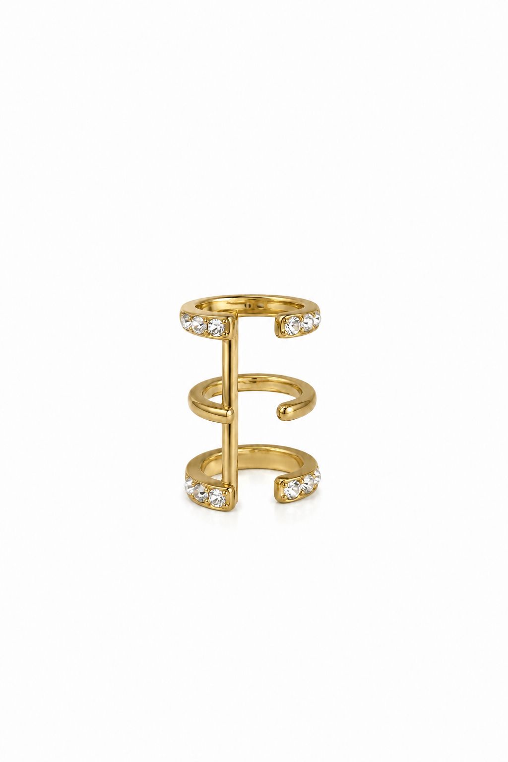 Gold plated ear cufff with small zirkons on a white background