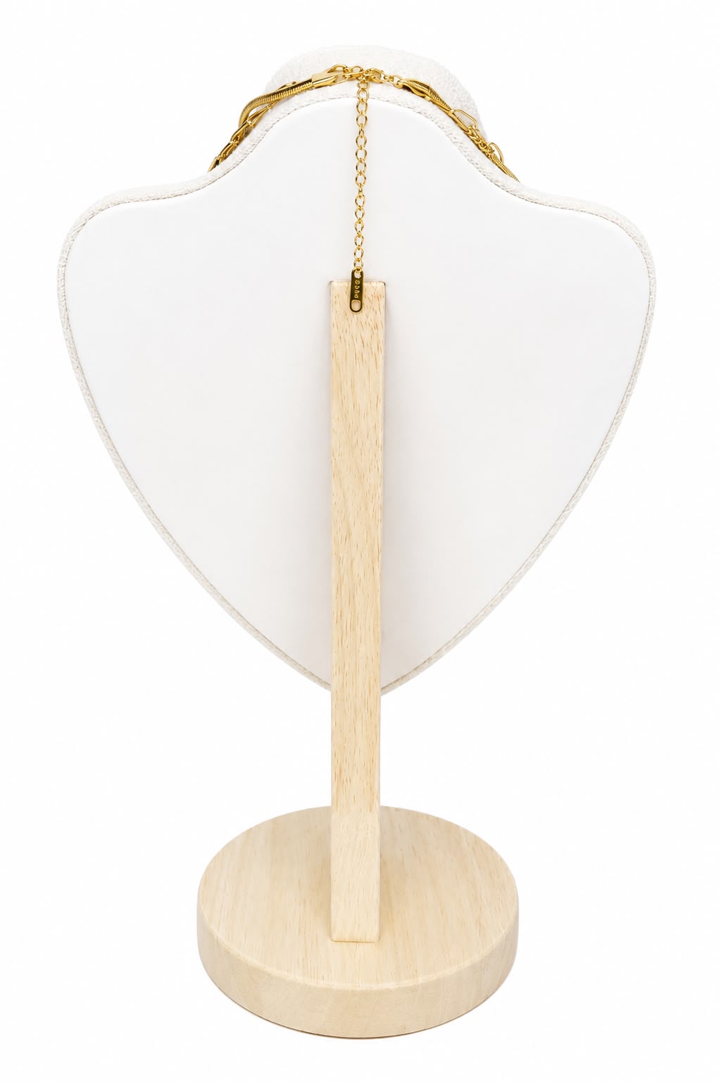 Heart-shaped jewelry stand with a wooden base and gold chain on a white background