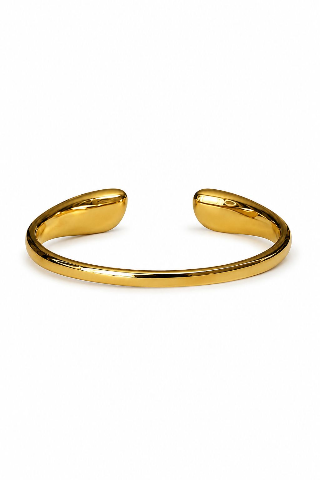 Gold bangle on a white background